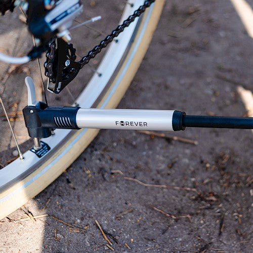 The hand pump is designed to be attached to the bicycle frame