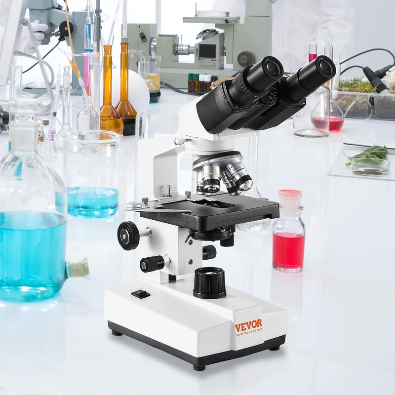 VEVOR binokulārais laboratorijas mikroskops ar LED apgaismojumu, 40–2500× palielinājums, divslāņu mehāniskais paraugu galds, komplektā tālruņa turētājs un mikroskopa priekšmetstikliņi