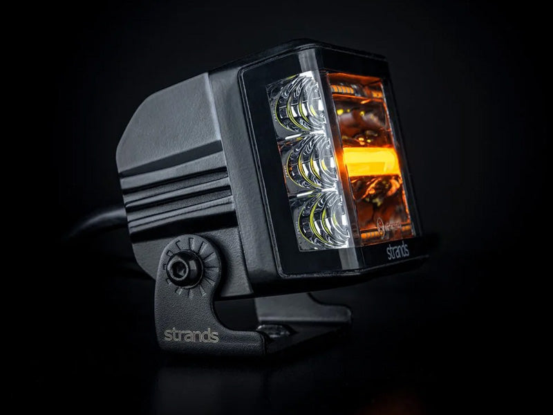 9-32V 8400Lm STRANDS(Zviedrija)  LED papildlukturis, IP67/69K, EMC ECE R10, 93,00 x 74,00 x 74,00 mm, vads 500mm, garantija 3 gadi, auksti balta gaisma 6000K
