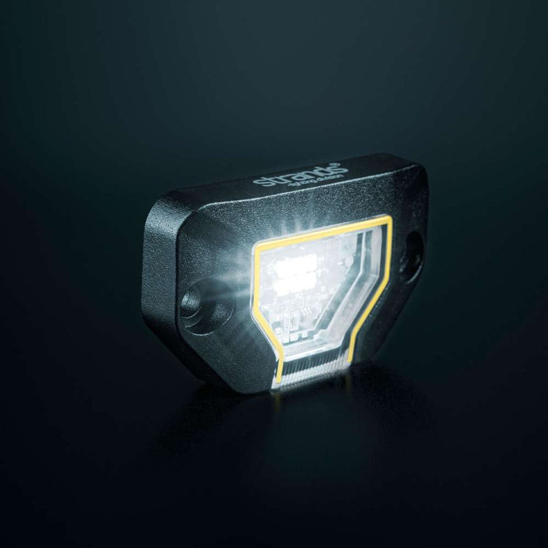 Strands Unity Rock Light balta LED pozīcijas un darba lampa 780 lm, 5700 K, 10–32 V DC, Flood Beam, IP69K, melna korpusa izpildījumā