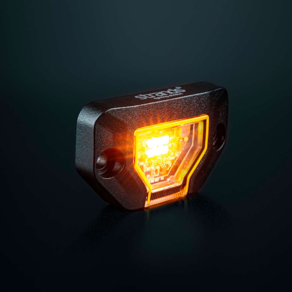 Strands Unity Rock Light oranža LED pozīcijas un darba lampa 340 lm, 10–32 V DC, Flood Beam, IP69K, melna korpusa izpildījumā