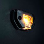 Strands Unity Rock Light oranža LED pozīcijas un darba lampa 340 lm, 10–32 V DC, Flood Beam, IP69K, melna korpusa izpildījumā