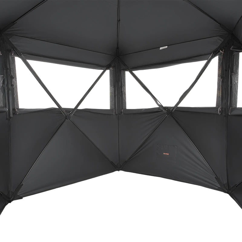 Jahipesa 6-7 inimesele koos kandekotiga, kaasaskantav kamuflaaž telk, tugevdatud vastupidav peidik, vaikse tõmblukuga ukse ja akna disainiga, sobib hirve- ja kalkunijahiks.