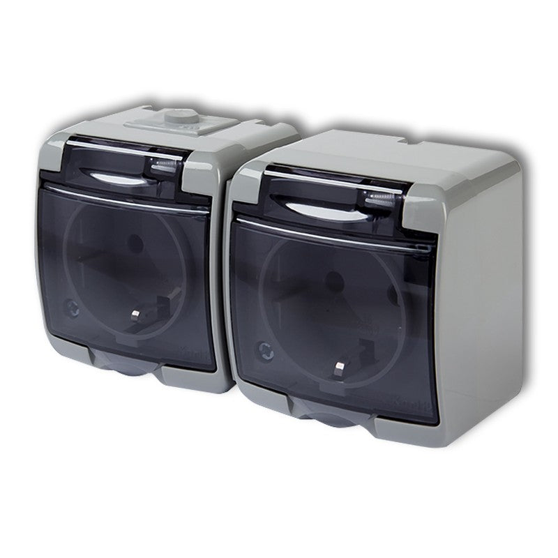 2-poolne pistikupesa Junior maandusega SCHUKO 2x(2P+Z) (läbipaistev kate; ilma lastekaitseta), v/a, IP54, hall