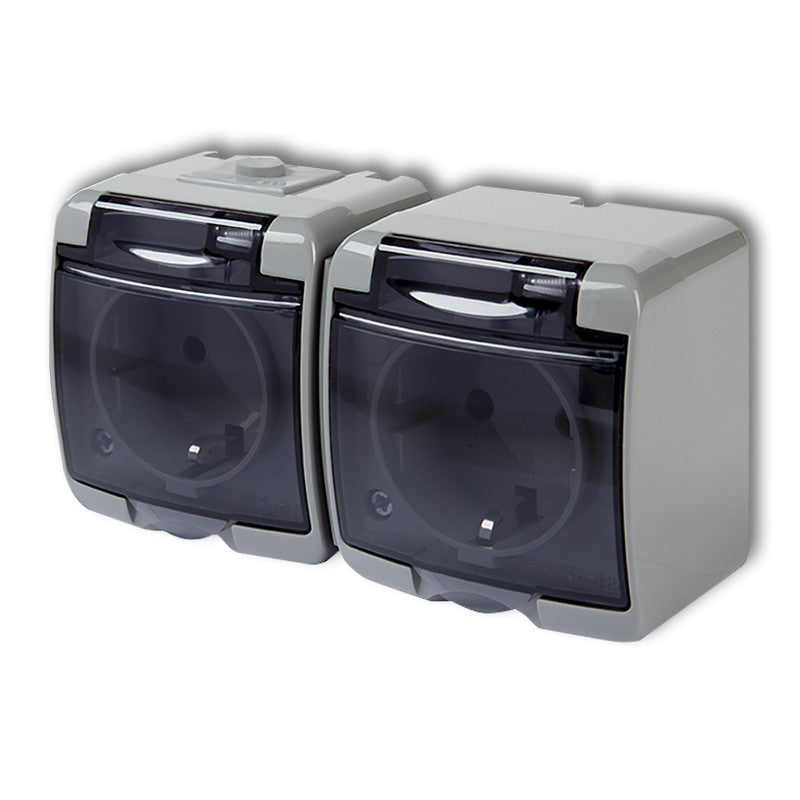 2-place. socket Junior with sub. SCHUKO 2x(2P+Z) (through.. trans.), v/a, IP54, gray