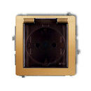 1-viet. kontaktligzdas meh. ar aizsardz. pret šļakatām DECO ar zemējumu SCHUKO 2P+Z (caurspīdīgs pārsegs), z/a, IP44, zelta kr.